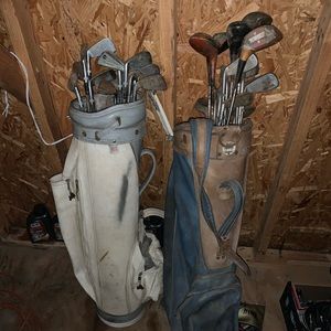 2 sets of golf clubs